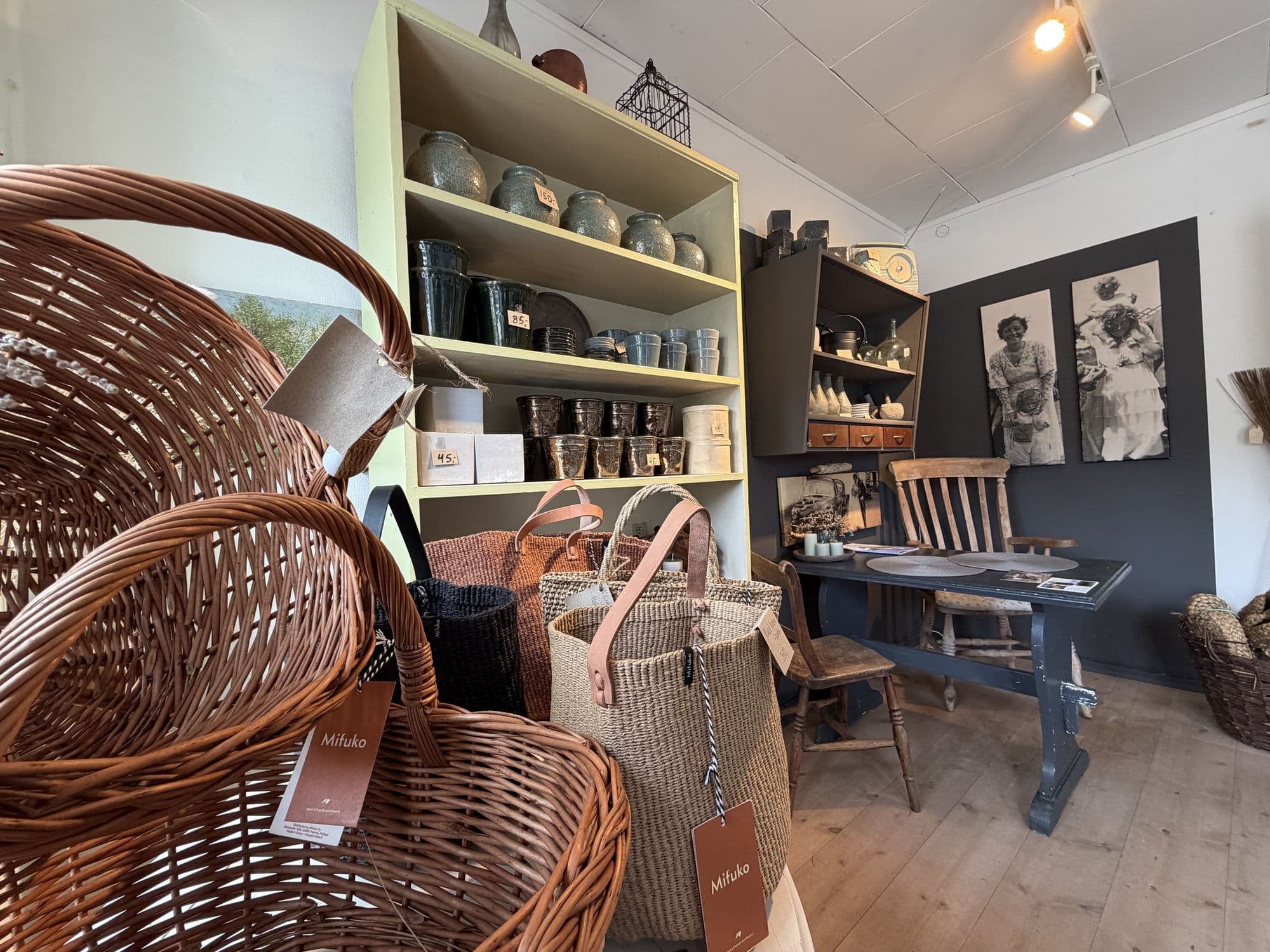 Woven baskets and bags on the shelves in the shop