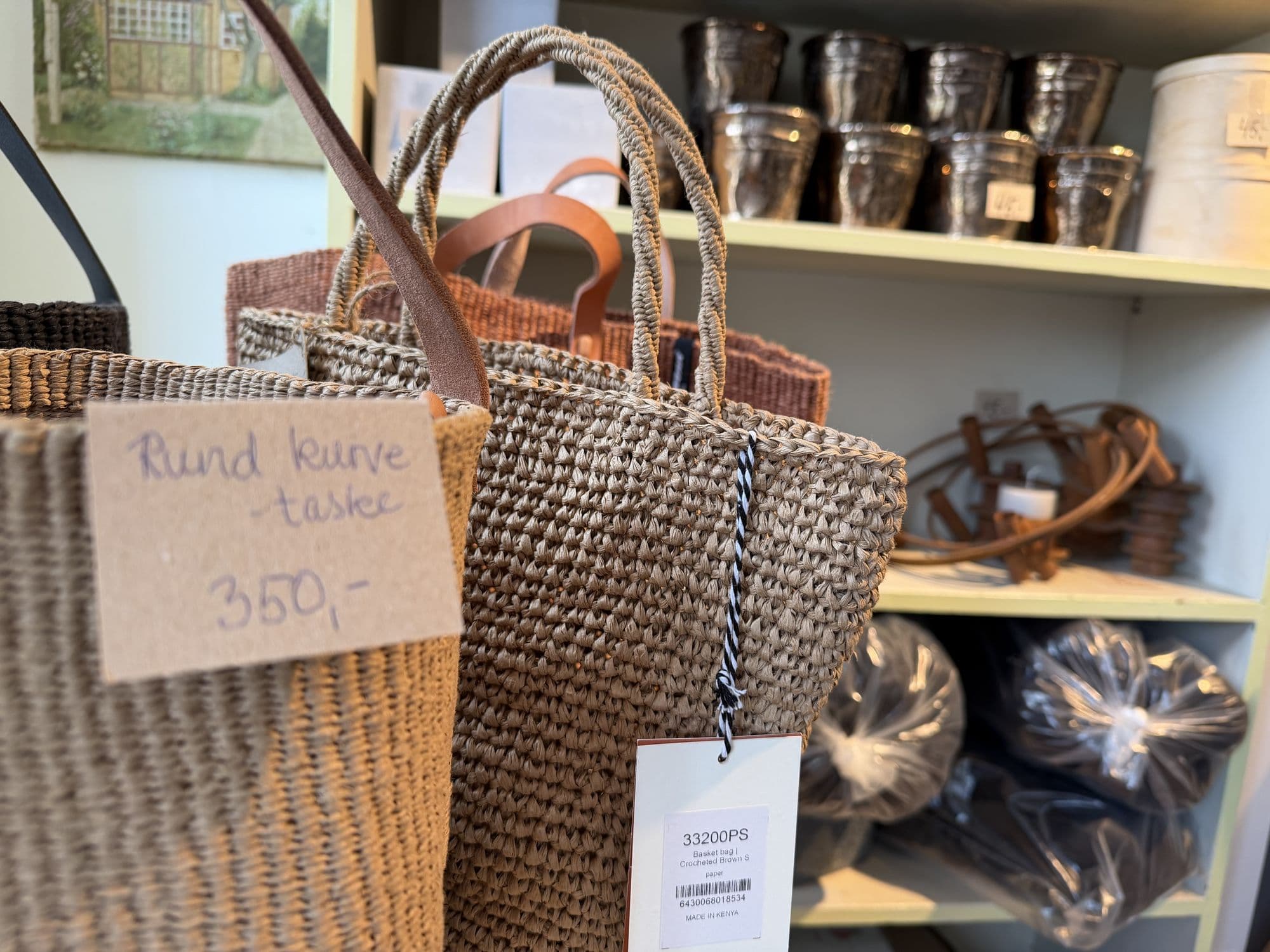 A handwoven basket bag with a price tag
