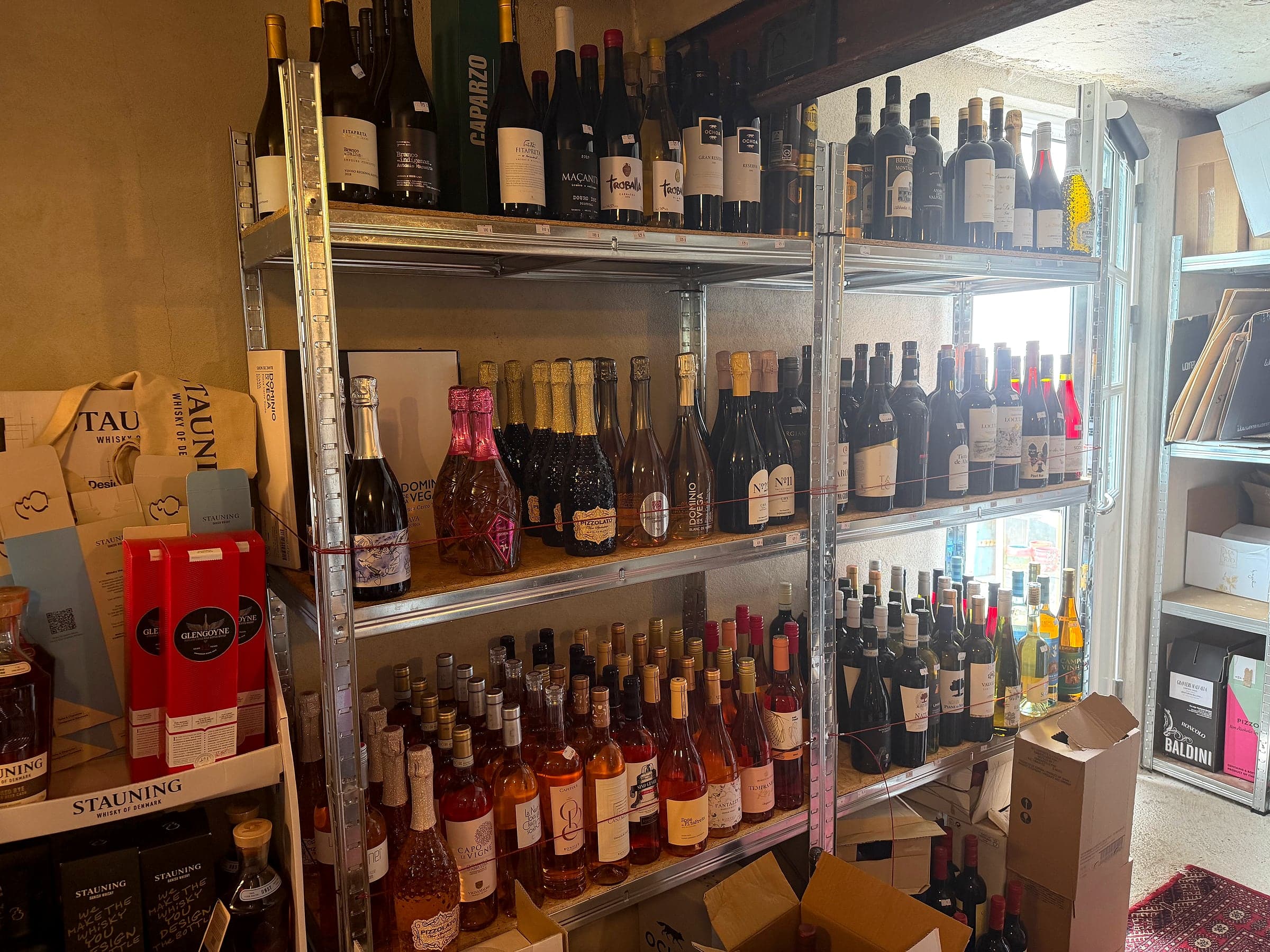 Wide shelf of red, white and sparkling wine at Gin & Vin Outlet