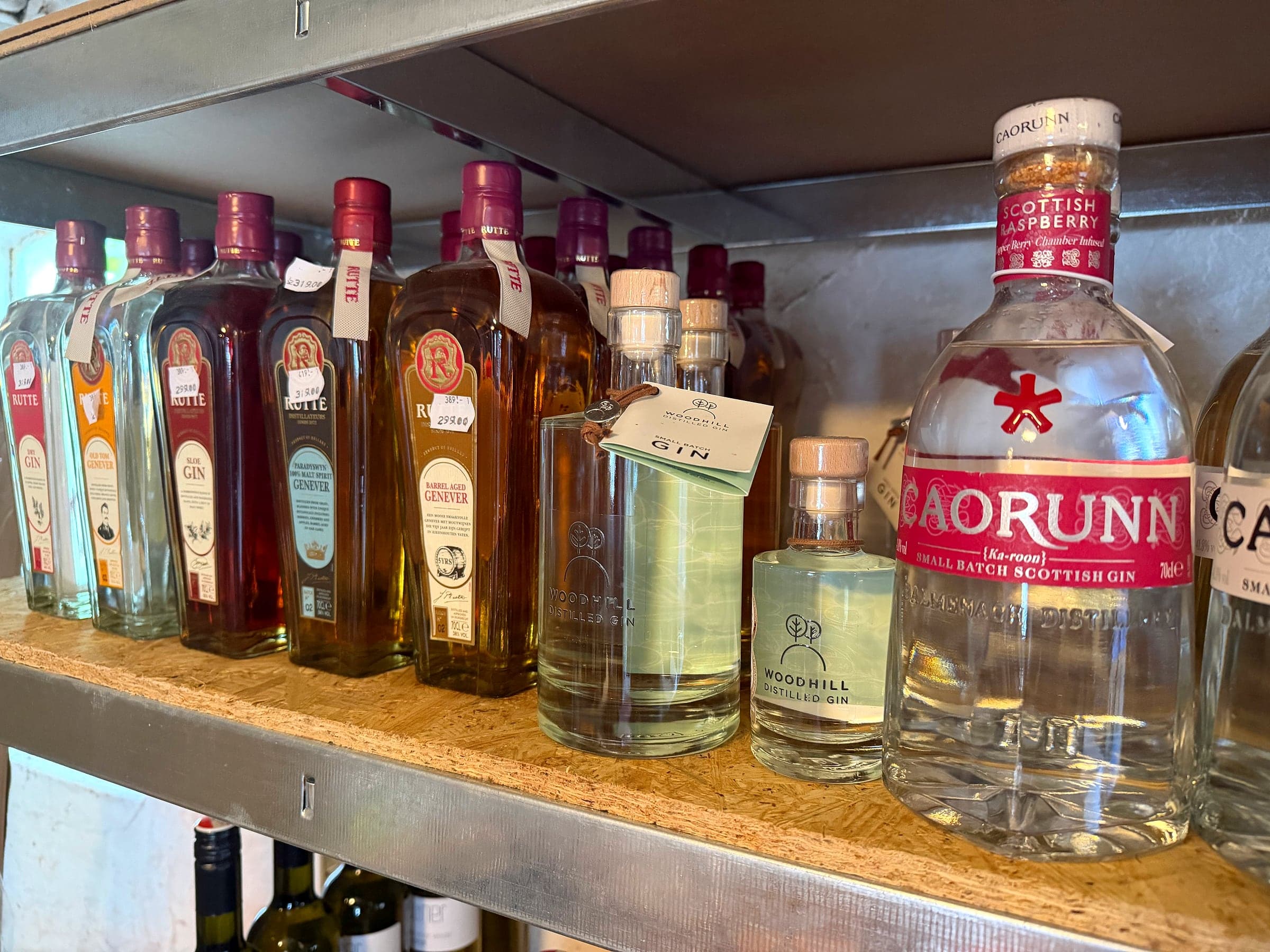 Wide shelf of different gin brands, including Rutte and Caorunn