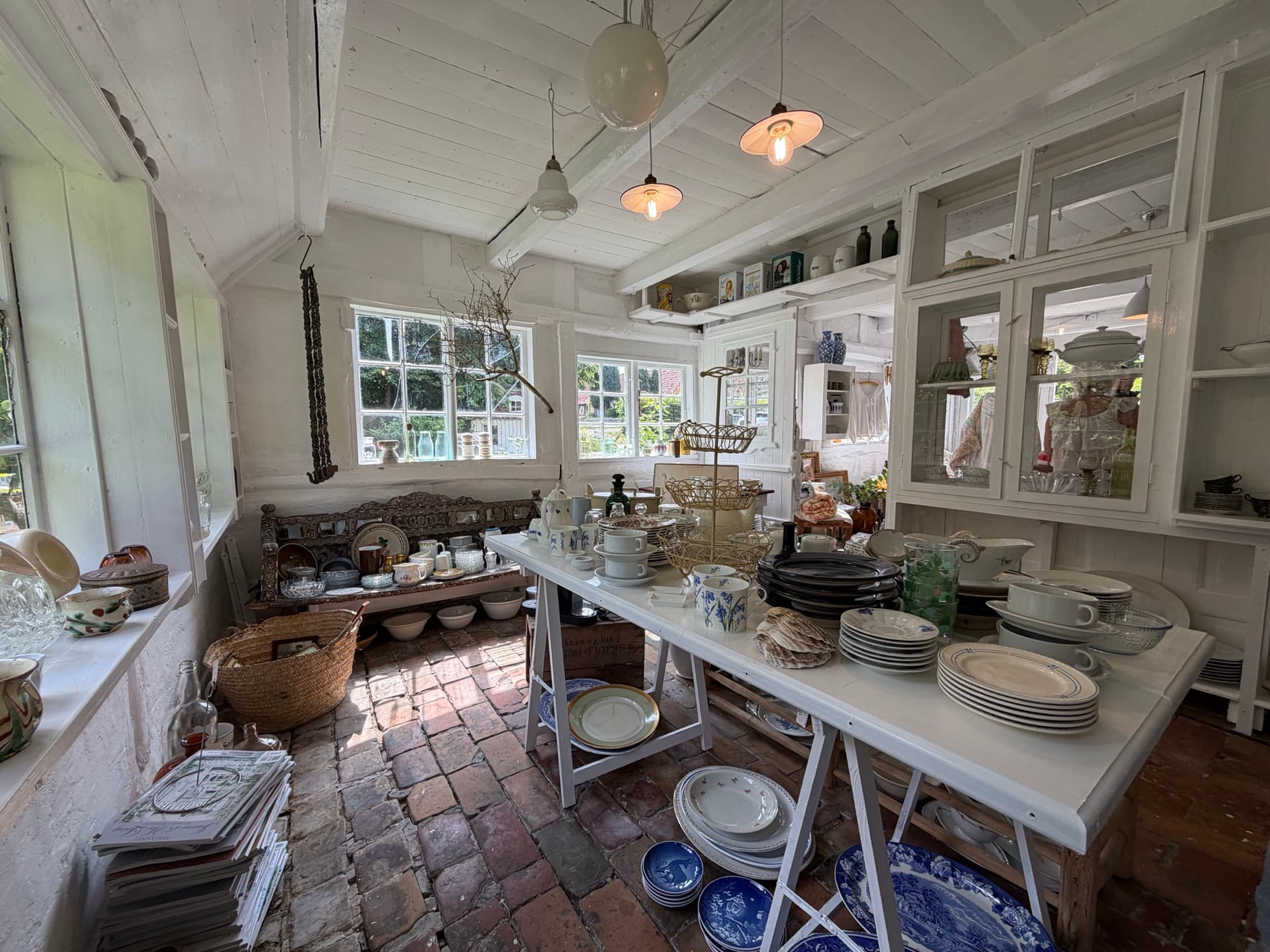 Shelves and cabinets filled with porcelain and glass