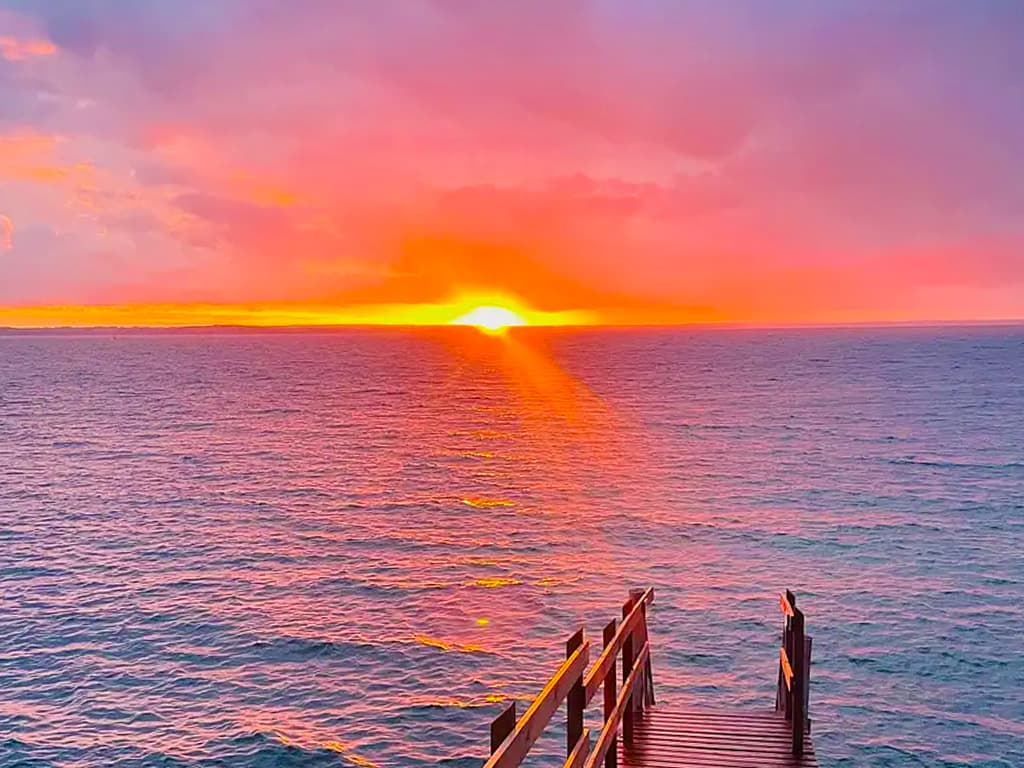Sunset over the water by the small bridge in Lohals